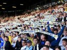 leeds-united-fans-hold-their-scarves-ahead-550nw-10237852cl.jpg