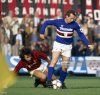 liam-brady-of-sampdoria-avoids-the-tackle-of-eric-gerets-of-ac-milan-picture-id93687238.jpg